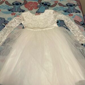 It is a white little girls wedding dress it has been worn one time